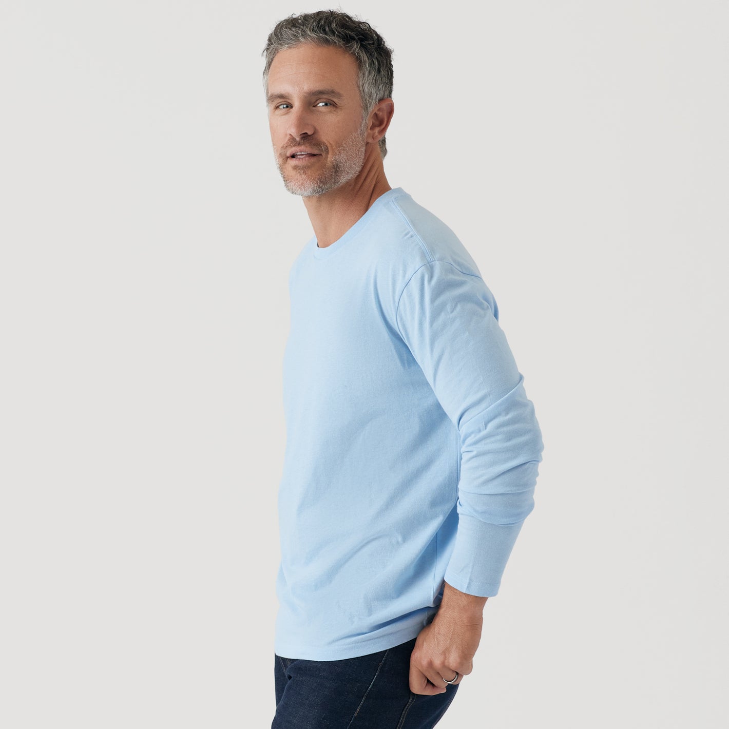 Man wearing Oxford Blue Long Sleeve Crew Neck Tee.