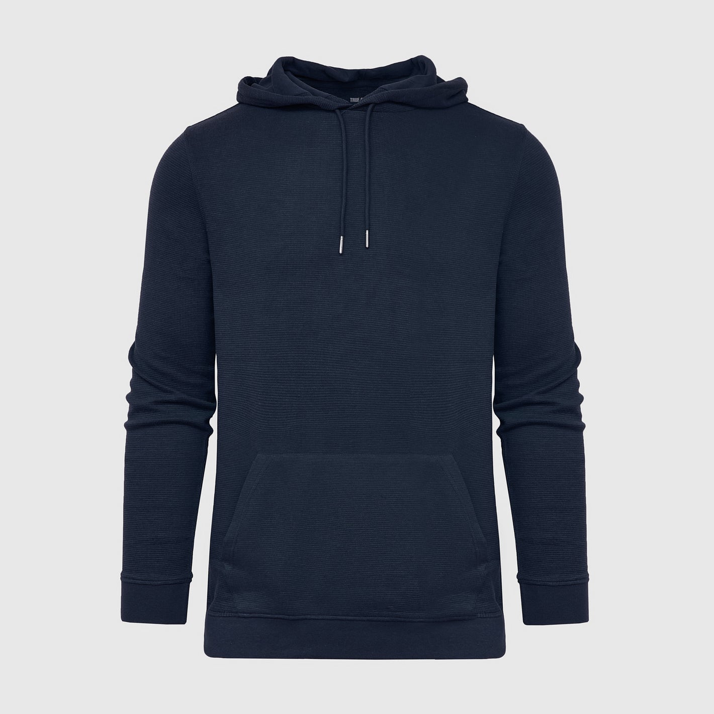 Navy Waffle Hoodie with kangaroo pocket and drawstring hood.