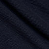 Navy Waffle Hoodie with textured knit fabric folds.