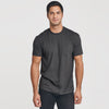 Young man wearing Carbon Pocket Crew Tee, dark jeans.