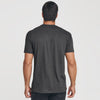 Man wearing Carbon Pocket Crew Tee, back view, in dark gray.
