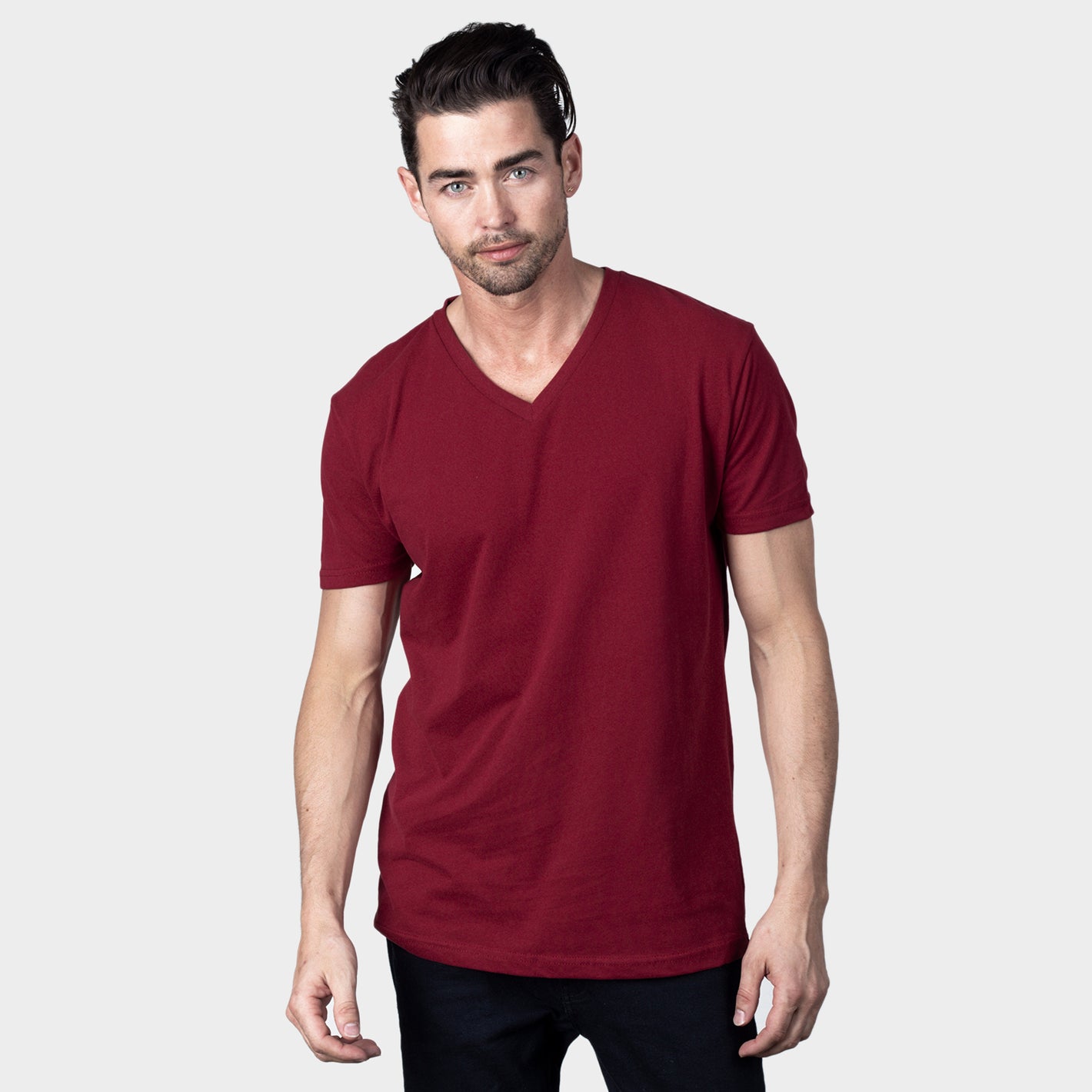 Man wearing the Cardinal V-Neck Tee, showcasing its athletic fit.